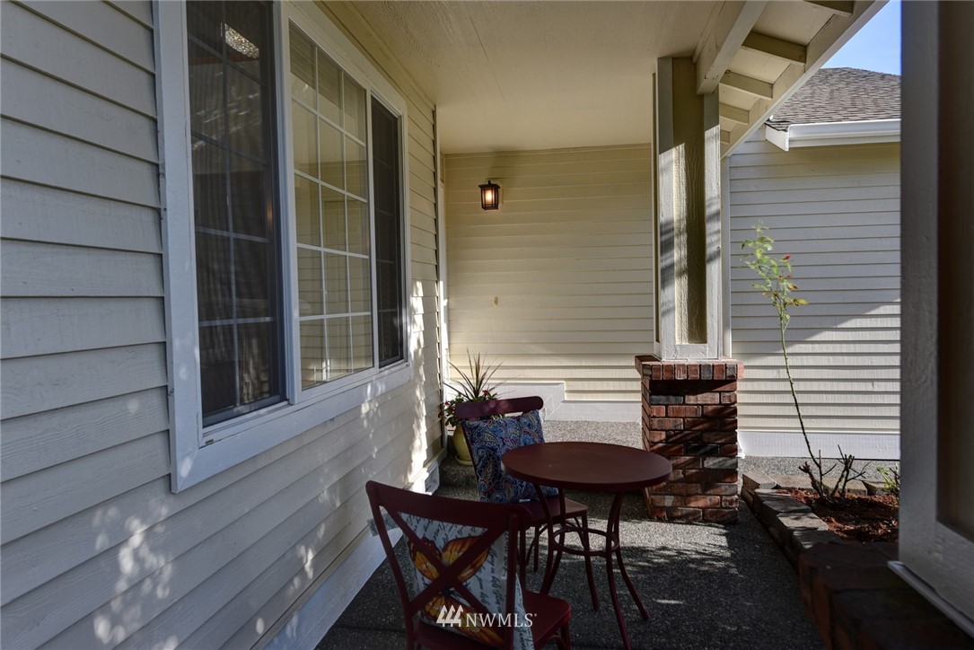 23215 9th Place West Bothell, WA 98021 - Photo 3 of 24 a balcony with table and chairs