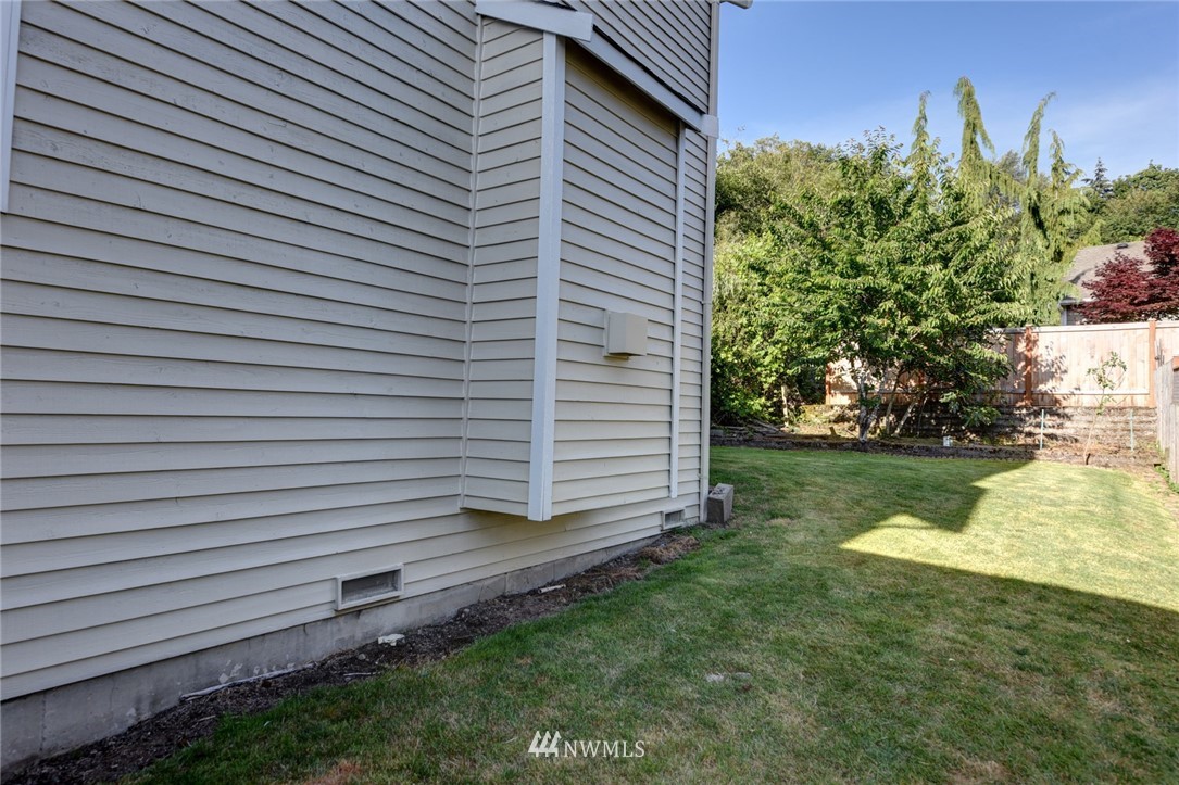 23215 9th Place West Bothell, WA 98021 - Photo 23 of 24 a view of a backyard with plants and a garden