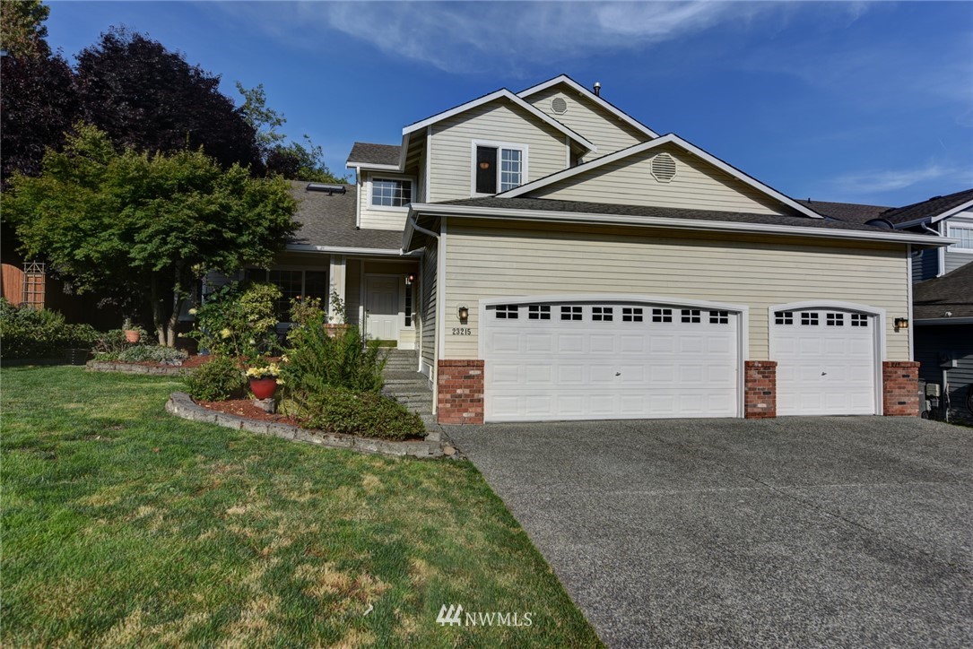23215 9th Place West Bothell, WA 98021 - Photo 24 of 24 a view of a white house with a big yard and large trees