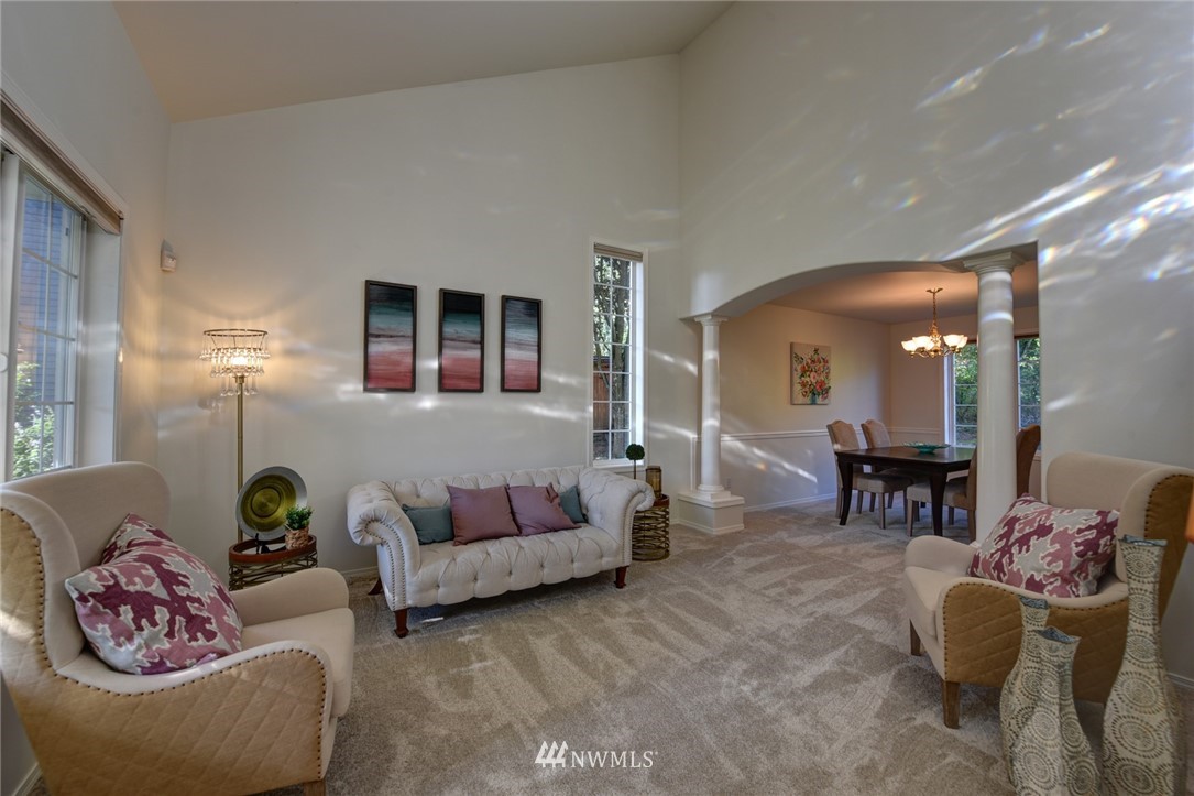23215 9th Place West Bothell, WA 98021 - Photo 4 of 24 a living room with furniture and wooden floor