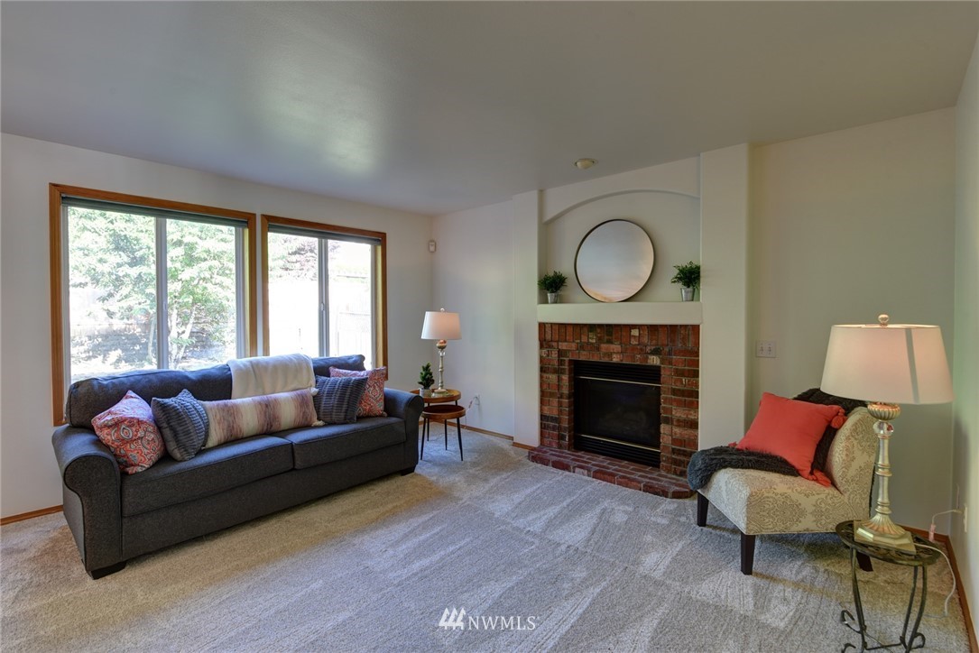 23215 9th Place West Bothell, WA 98021 - Photo 10 of 24 a living room with furniture and a fireplace