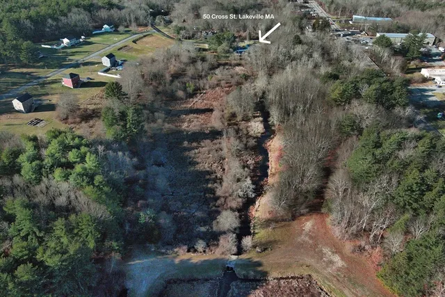 an aerial view of residential house with outdoor space