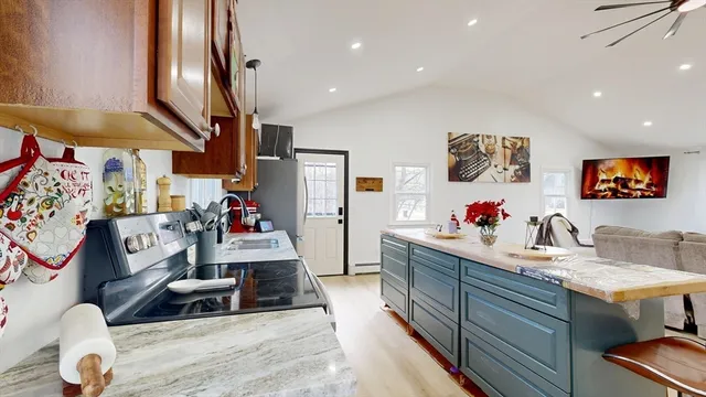 a view of kitchen with furniture and wooden floor