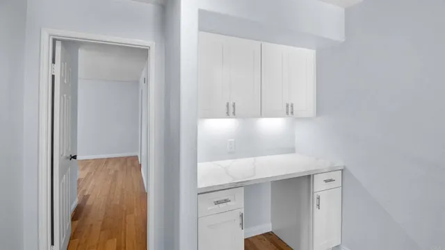 a bathroom with a shower and a glass door