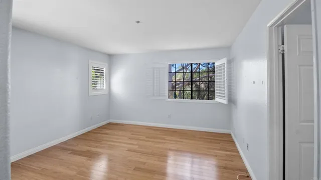 a view of a kitchen with refrigerator and microwave
