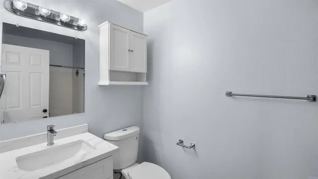 a view of a backyard with sitting area