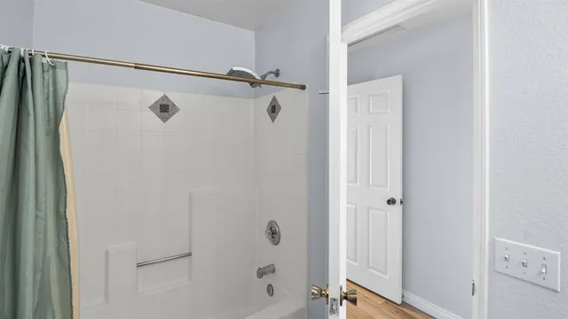 a view of a swimming pool with a yard and lake view