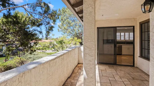 a view of a room with wooden floor and cabinet