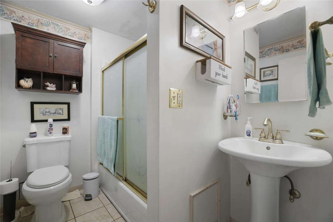 2371 Honeysuckle Road Allentown, PA 18103 - Photo 13 of 25 Functional layout maximizes utility in this classic washroom featuring a pedestal sink.