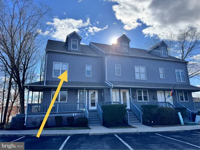 a view of a large building with a swimming pool