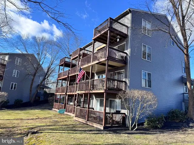 a view of a house with a balcony and stairs