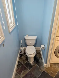 a bathroom with a toilet and a sink