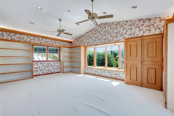 a view of a livingroom with an empty space and a window