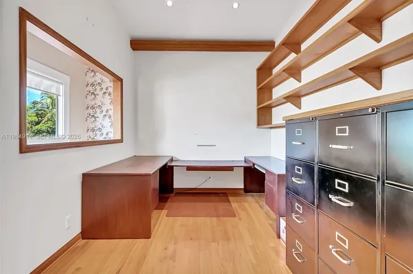 a view of workspace with furniture and window