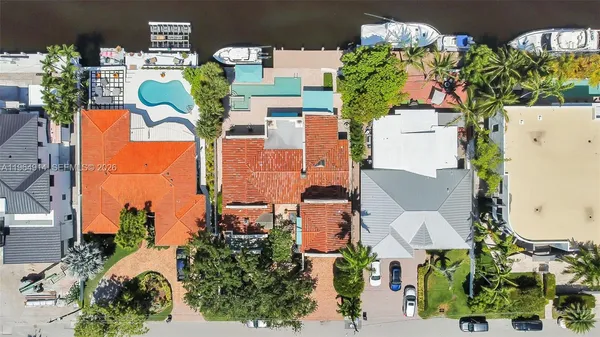 an aerial view of residential house with outdoor space and parking