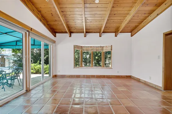 a view of an empty room with windows