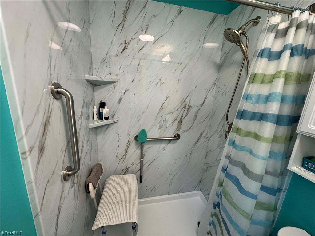 2436 Wickham Road Kernersville, NC 27284 - Photo 18 of 31 Primary shower with grab bars