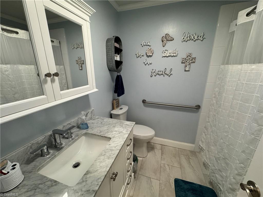 2436 Wickham Road Kernersville, NC 27284 - Photo 23 of 31 Hall bathroom with toilet grab bar