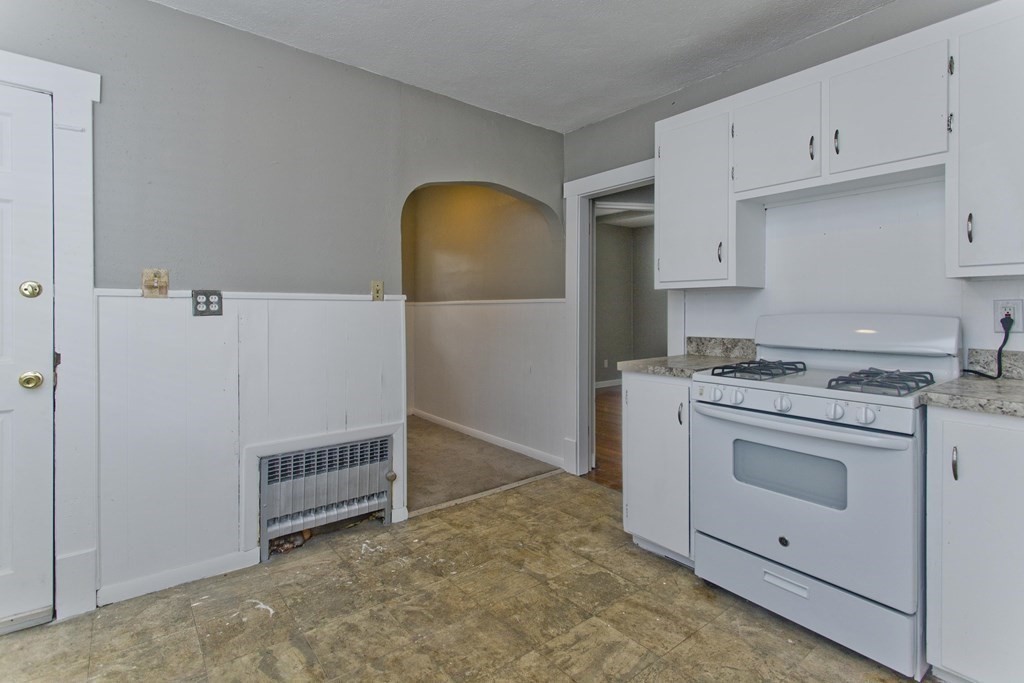 69 Appleton Street Springfield, MA 01108 - Photo 12 of 34 a view of kitchen with stove and refrigerator