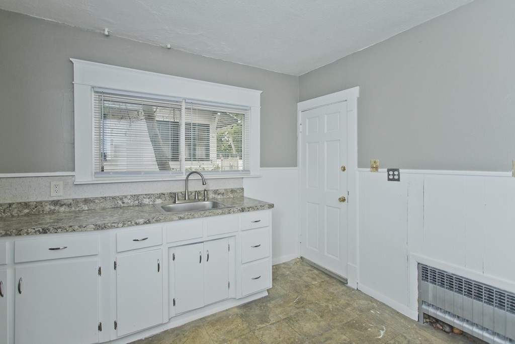 69 Appleton Street Springfield, MA 01108 - Photo 14 of 34 a view with cabinets a sink and dishwasher