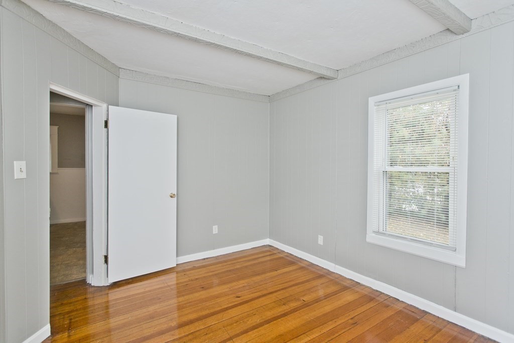69 Appleton Street Springfield, MA 01108 - Photo 18 of 34 a view of empty room with wooden floor and fan