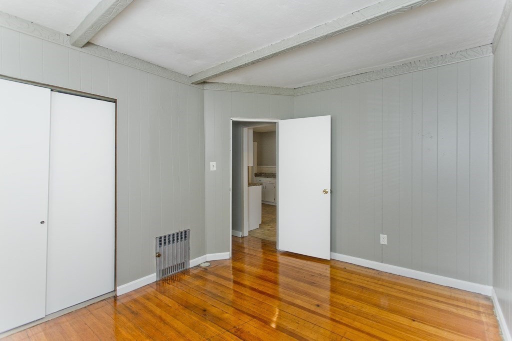 69 Appleton Street Springfield, MA 01108 - Photo 19 of 34 a view of an empty room with wooden floor