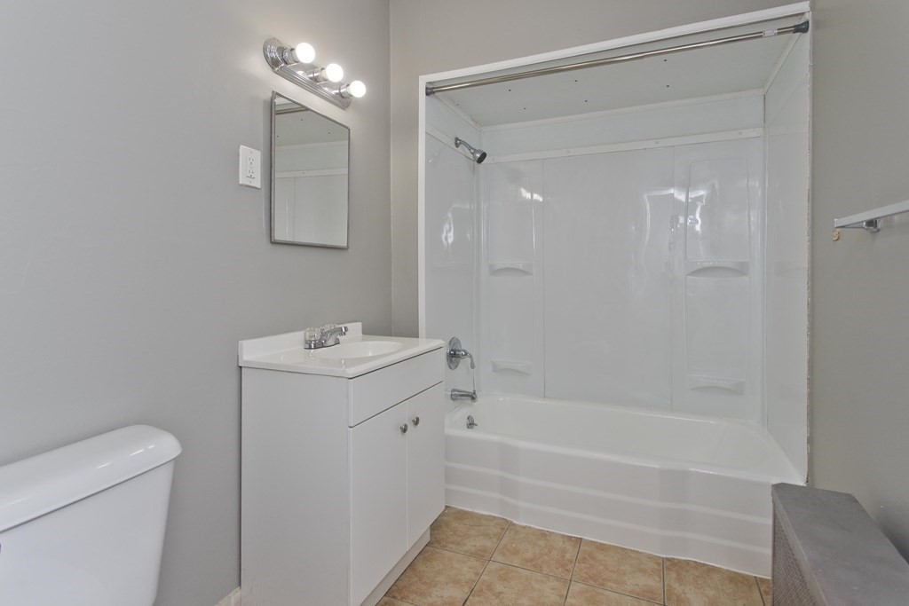 69 Appleton Street Springfield, MA 01108 - Photo 22 of 34 a bathroom with a sink a toilet and shower