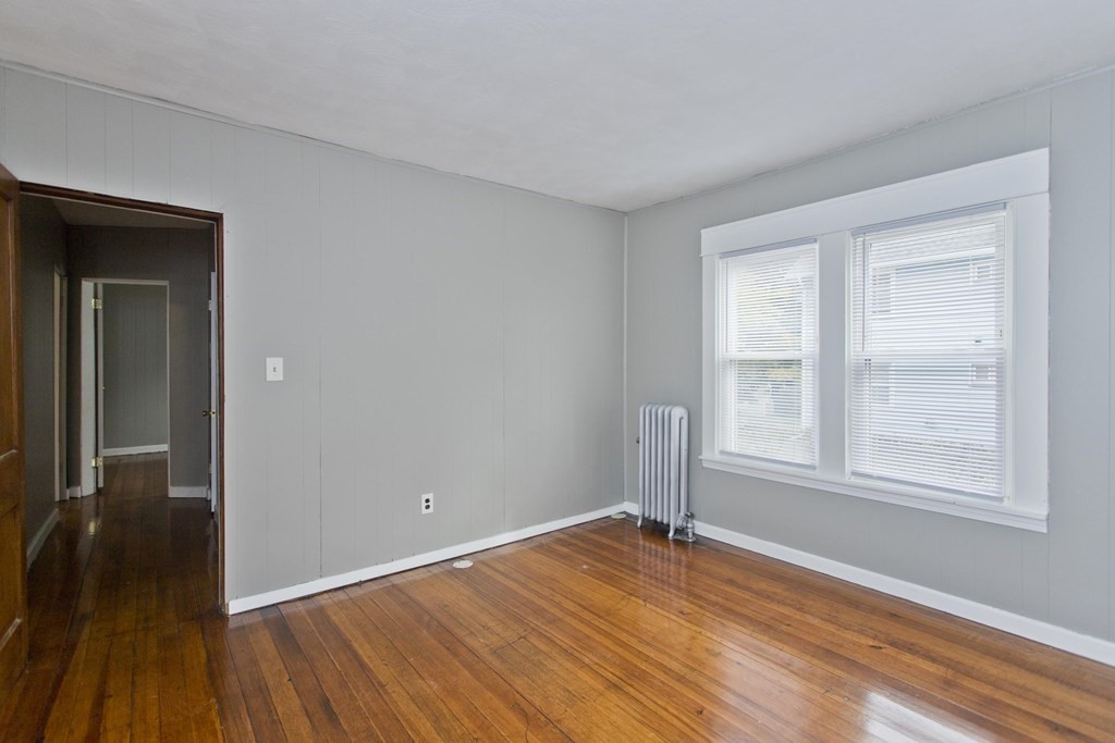 69 Appleton Street Springfield, MA 01108 - Photo 24 of 34 a view of empty room with wooden floor and fan