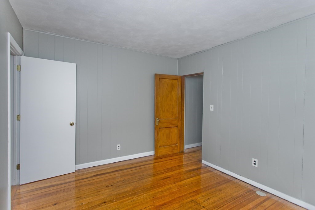 69 Appleton Street Springfield, MA 01108 - Photo 27 of 34 a view of empty room with wooden floor and bathroom