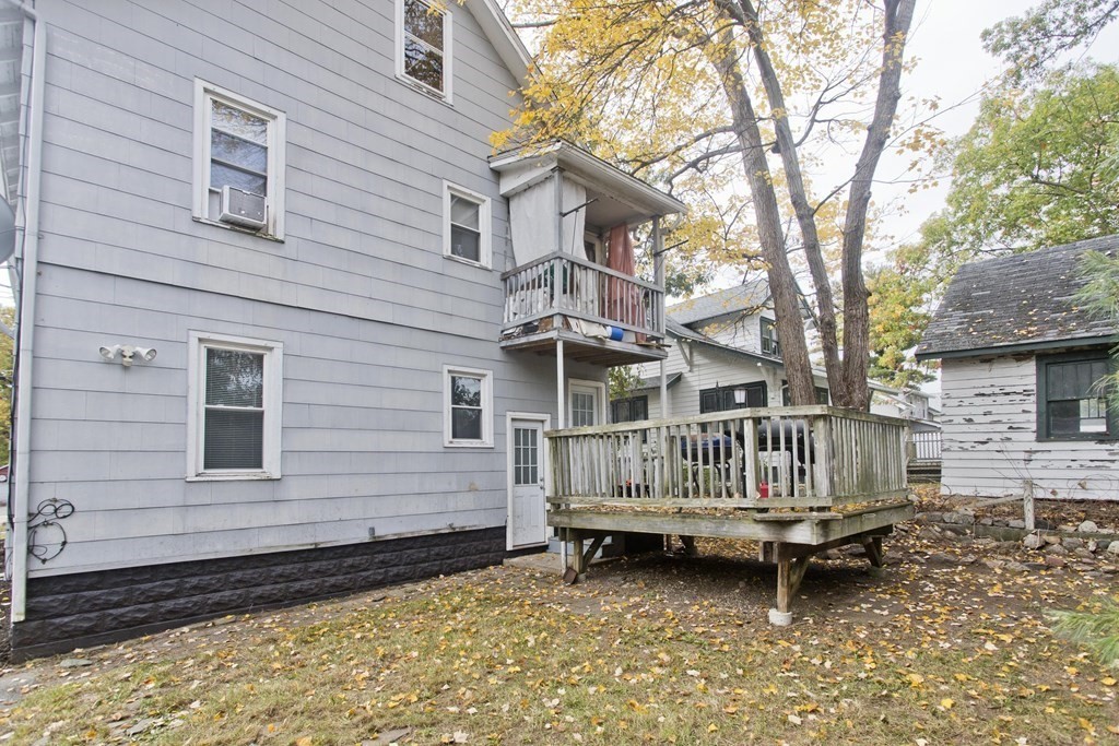 69 Appleton Street Springfield, MA 01108 - Photo 29 of 34 a backyard of a house with barbeque oven and outdoor seating