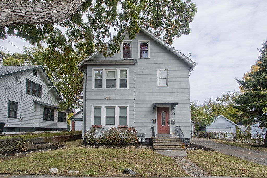 69 Appleton Street Springfield, MA 01108 - Photo 3 of 34 a front view of a house with garden