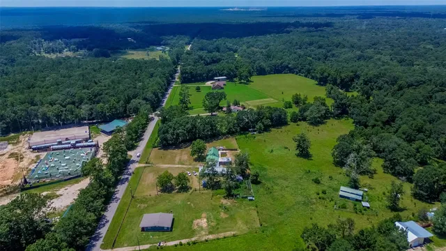 an aerial view of residential house with outdoor space