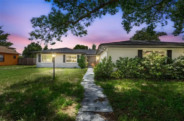 a view of a house with garden