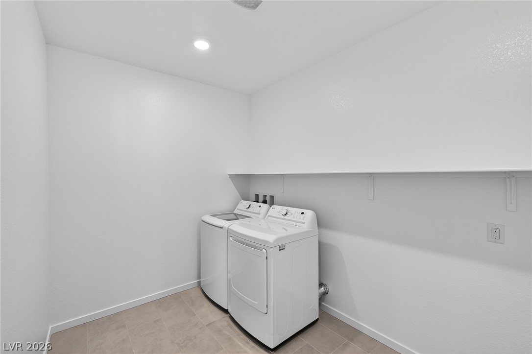 347 Sam Way Mesquite, NV 89027 - Photo 31 of 32 Functional laundry room offers a convenient side-by-side washer and dryer with ample overhead shelving.