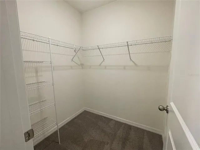 a bathroom with a double vanity sink and mirror