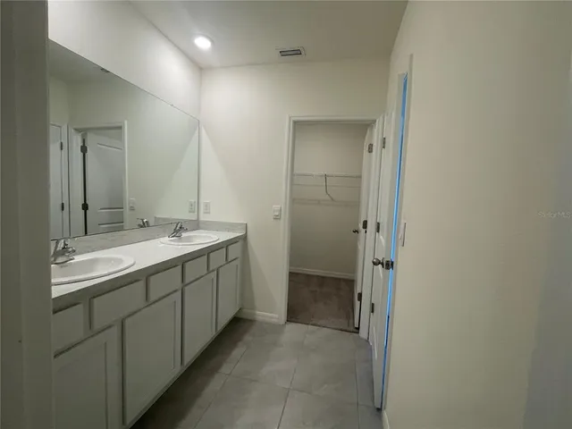 a bathroom with a shower a toilet and sink
