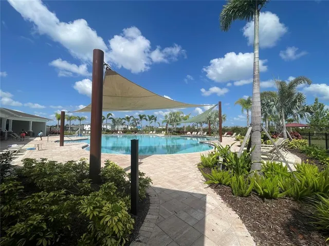 a view of a lake with a house in the background