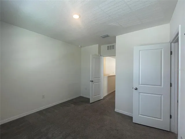 an empty room with closet area