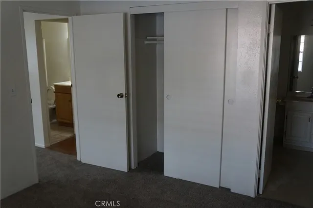 a white toilet sitting next to a bathroom sink