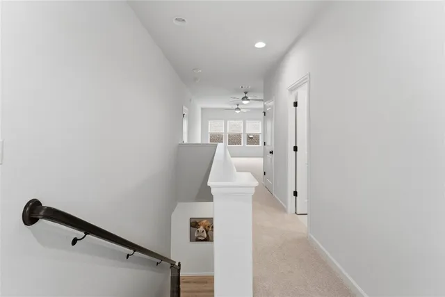 an entryway in a hall with a window