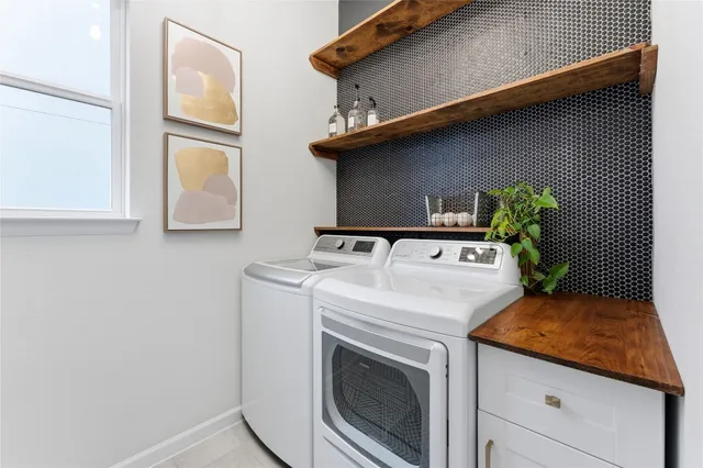 a utility room with dryer and washer
