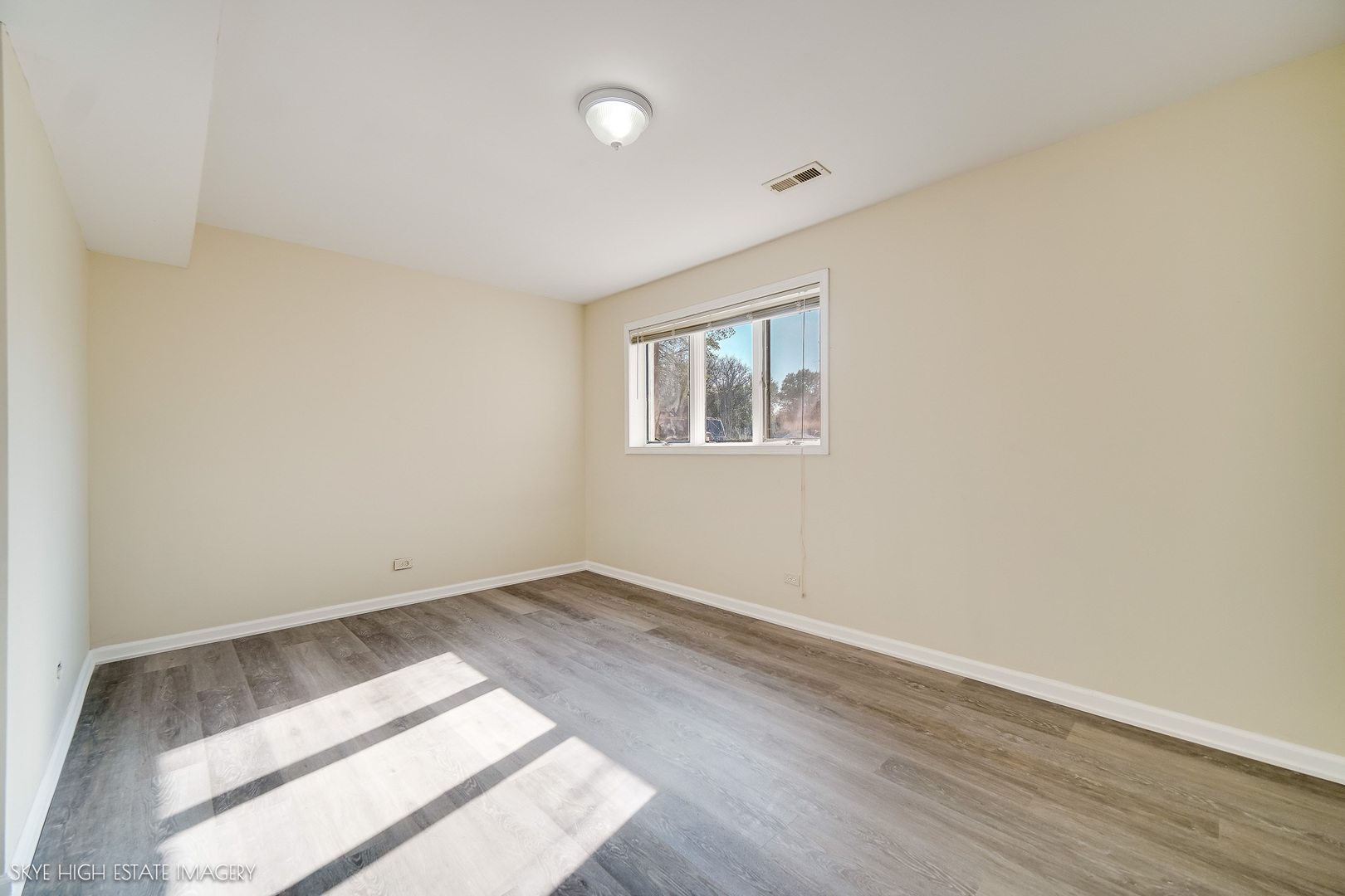 24615 Mulberry Lane Crete, IL 60417 - Photo 18 of 21 an empty room with wooden floor and windows