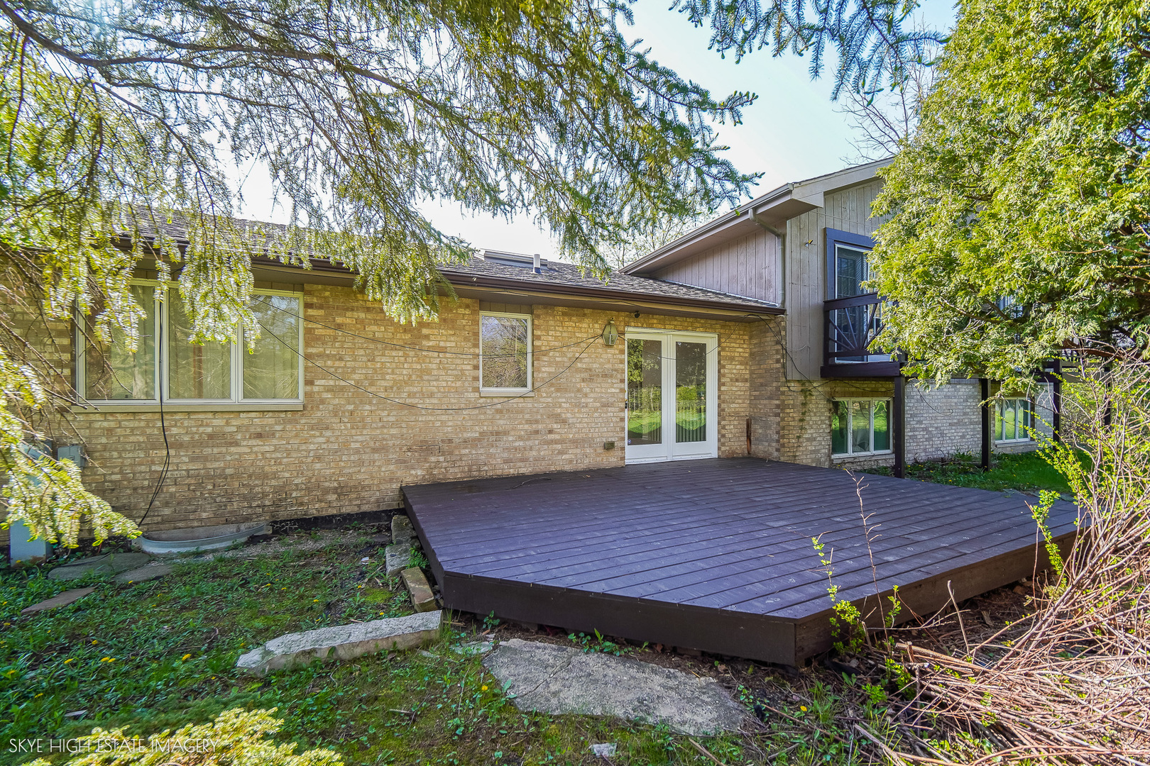 24615 Mulberry Lane Crete, IL 60417 - Photo 20 of 21 a view of a backyard with a deck and a tree