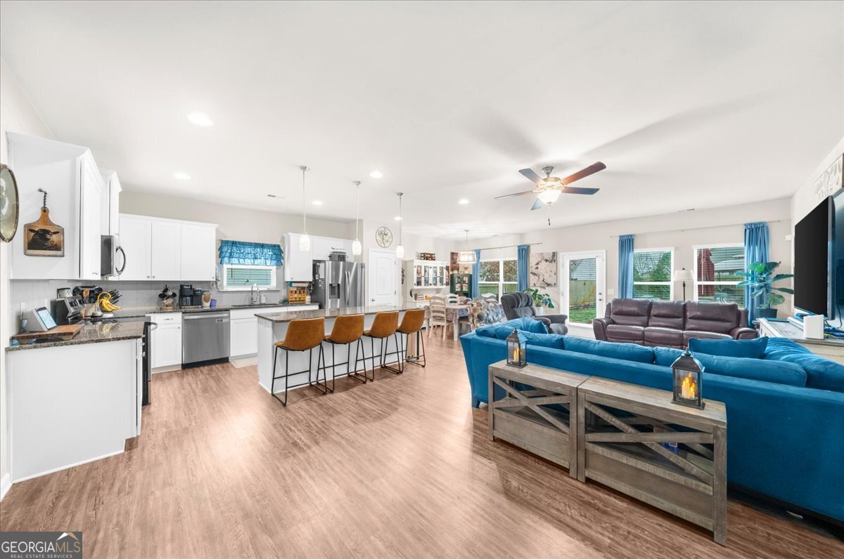 15 Gala Drive Northeast Rome, GA 30165 - Photo 13 of 60 a living room with furniture kitchen view and a wooden floor