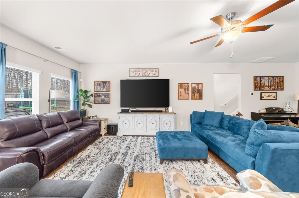 15 Gala Drive Northeast Rome, GA 30165 - Photo 16 of 60 a living room with furniture and a flat screen tv