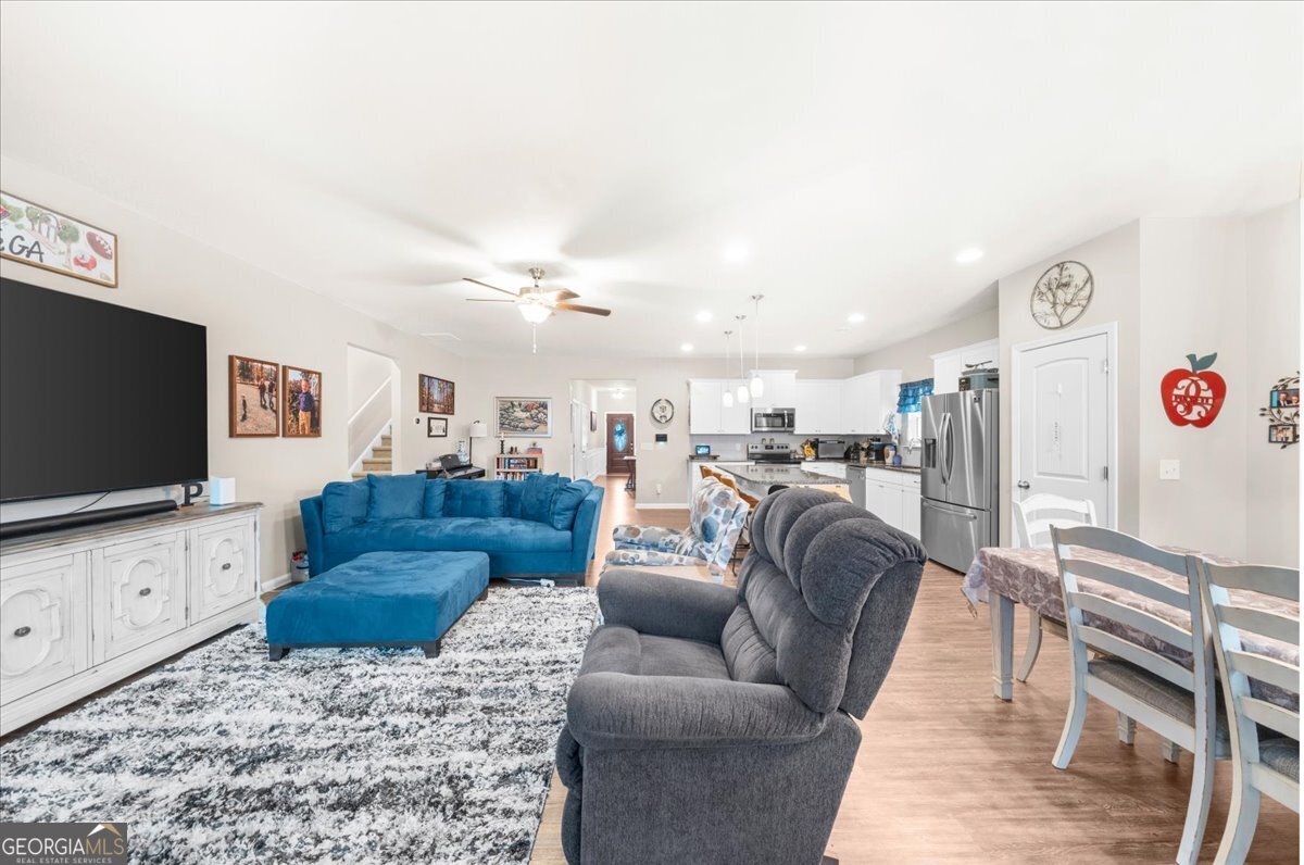 15 Gala Drive Northeast Rome, GA 30165 - Photo 19 of 60 a living room with furniture and a flat screen tv