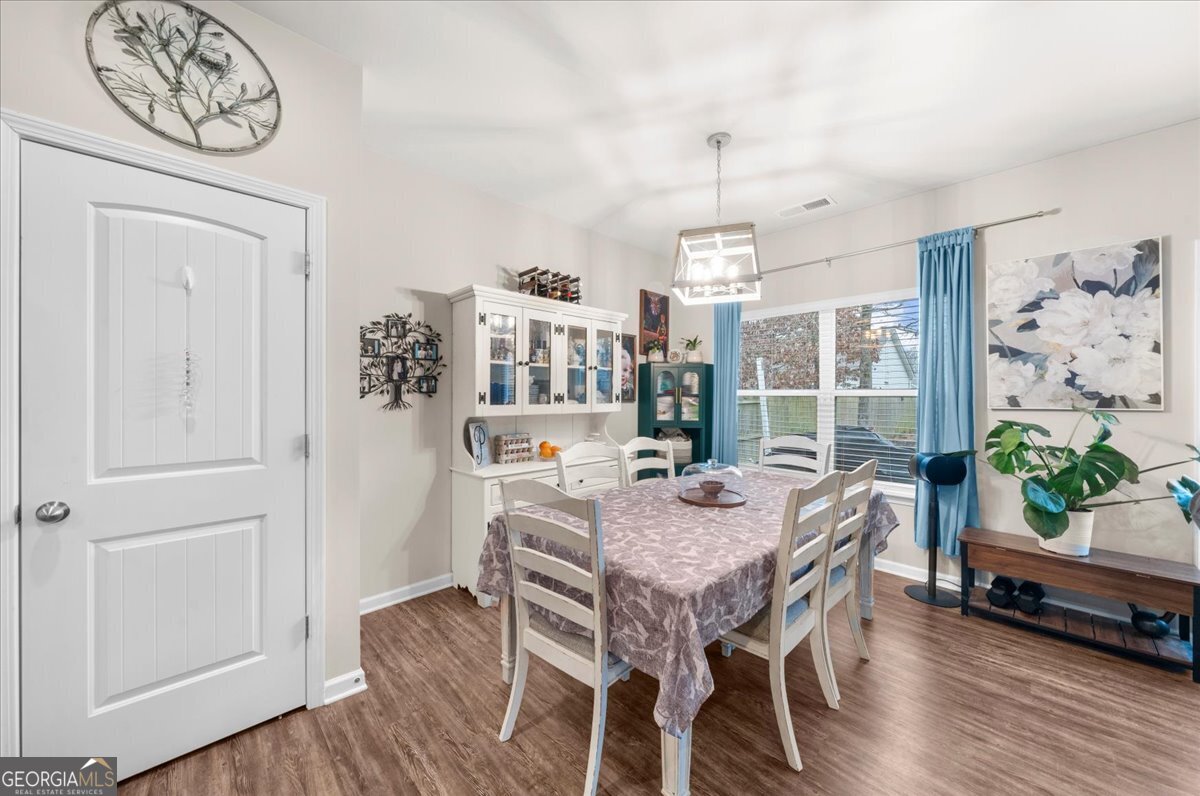 15 Gala Drive Northeast Rome, GA 30165 - Photo 25 of 60 a view of a dining room with furniture window and wooden floor