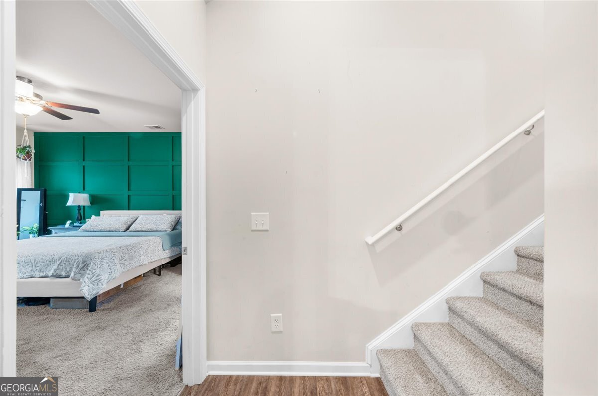 15 Gala Drive Northeast Rome, GA 30165 - Photo 29 of 60 a bedroom with a bed and a mirror