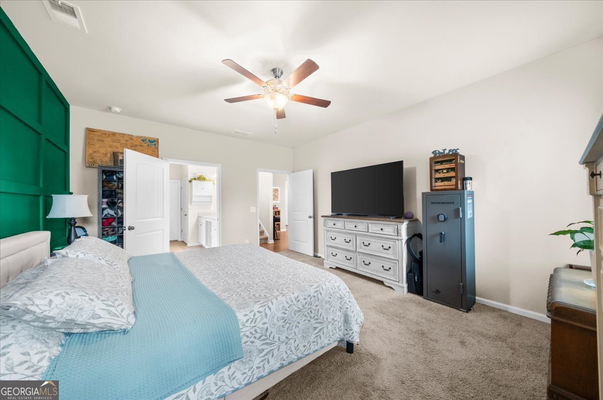 15 Gala Drive Northeast Rome, GA 30165 - Photo 33 of 60 a bedroom with a bed and a flat screen tv