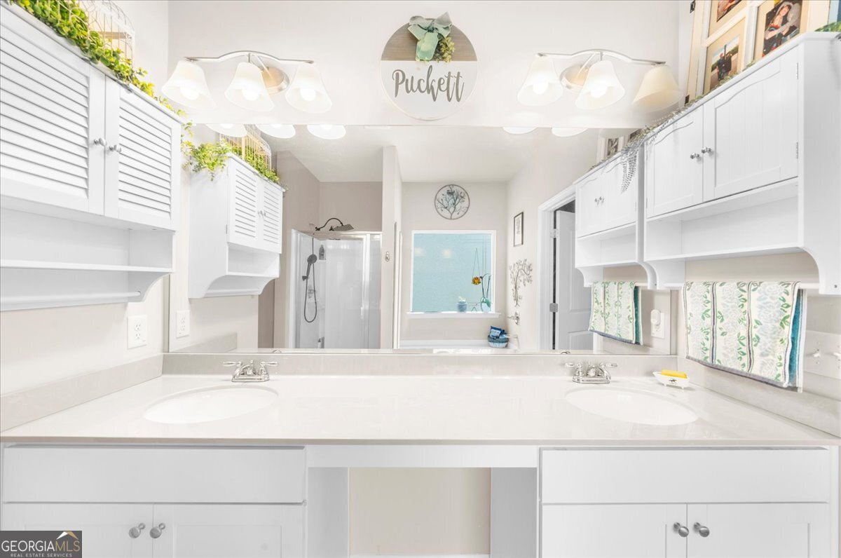 15 Gala Drive Northeast Rome, GA 30165 - Photo 38 of 60 a bathroom with a sink and a mirror